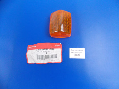 NOS OEM HONDA 1997-99 NX500 FLASHING TURN SIGNAL LIGHT LENS AMBER 33402-MAK-000 - MotoRaider