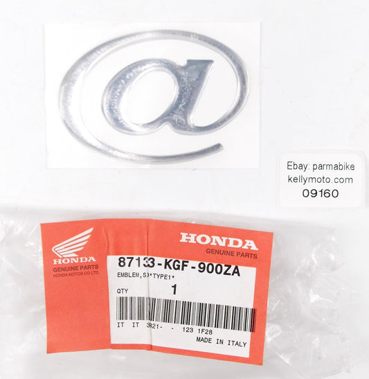 NOS OEM 2001 HONDA NES125 "@" SIDE COVER EMBLEM LOGO TYPE 1  87133-KGF-900ZA - MotoRaider