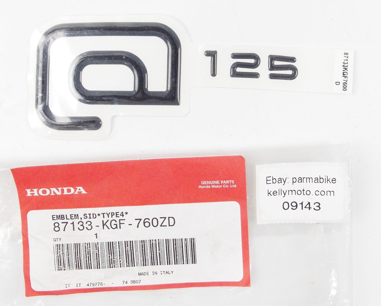 NOS OEM 2002-2003 HONDA CHIOCCOLA 125 SIDE COVER EMBLEM TYPE 4  87133-KGF-760ZD - MotoRaider