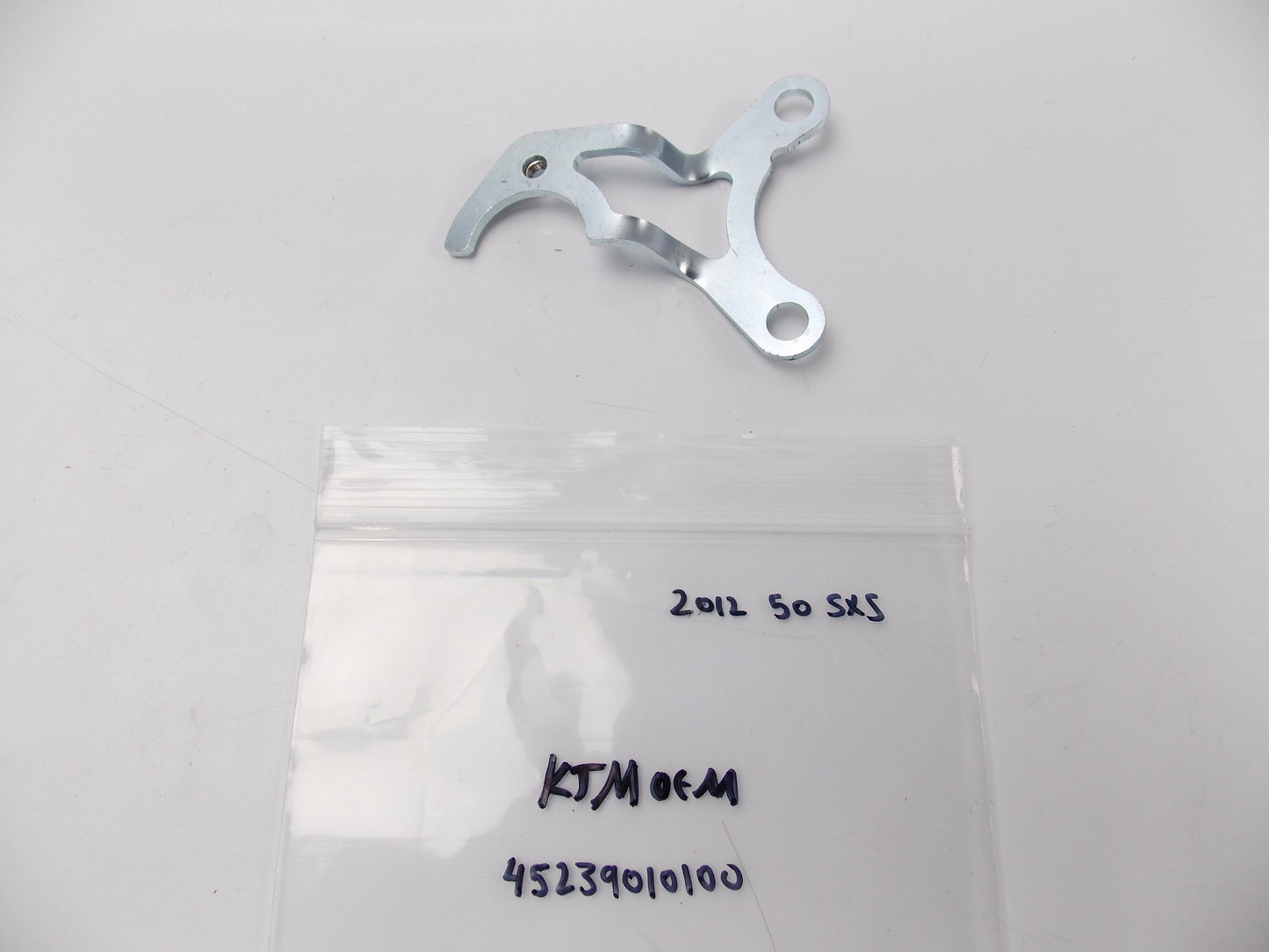 OEM KTM 2012 50 SXS IGNITION COIL RETAINER BRACKET 45239010100 | 452.39.010.100 - MotoRaider