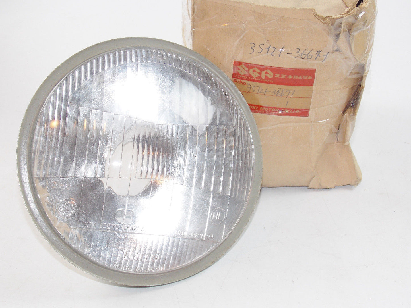 NOS OEM NEW SUZUKI 1978 GS400 GS400E HEADLIGHT LAMP UNIT REFLECTOR 35121-36671 - MotoRaider