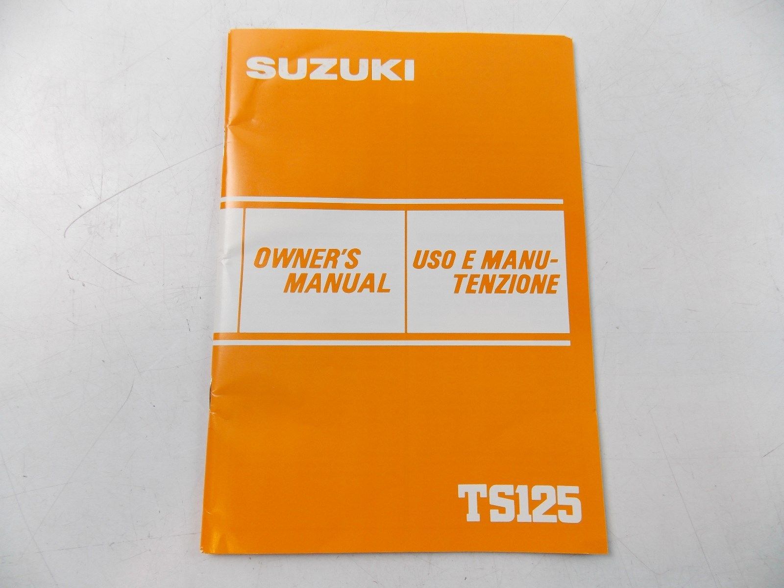 NEW SUZUKI 1983 OWNER'S MANUAL BOOK TS125 ENGLISH ITALIAN  99011-48021-026 - MotoRaider