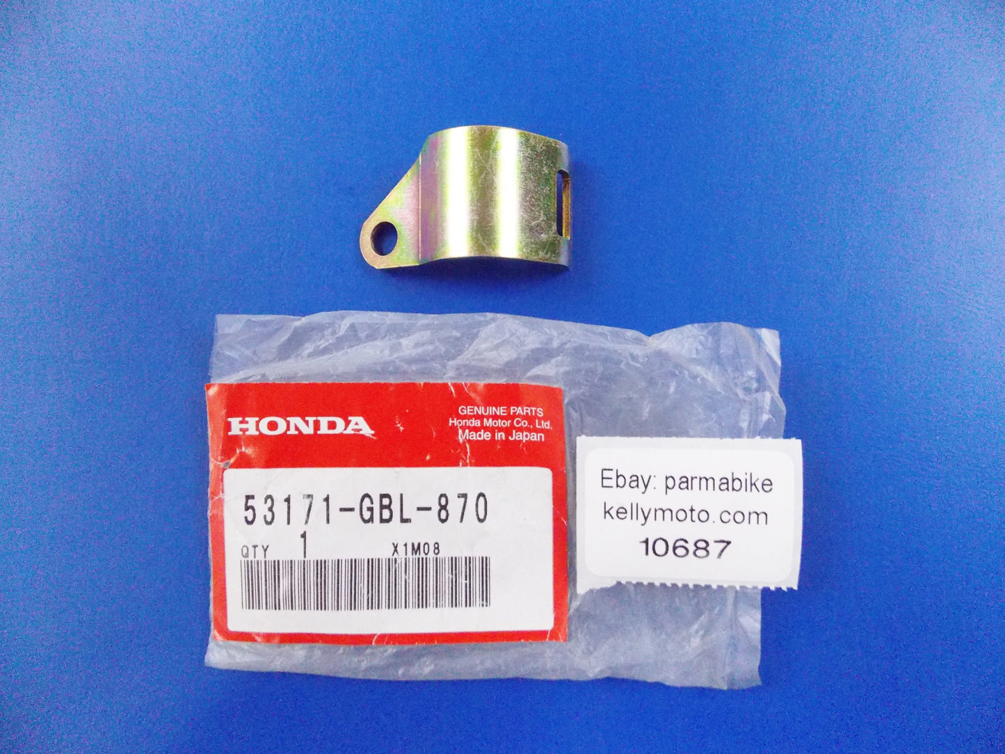 NOS OEM HONDA 2000-2006 NES125 | 2009 UH125D HANDLE BRACKET BAND 53171-GBL-870 - MotoRaider