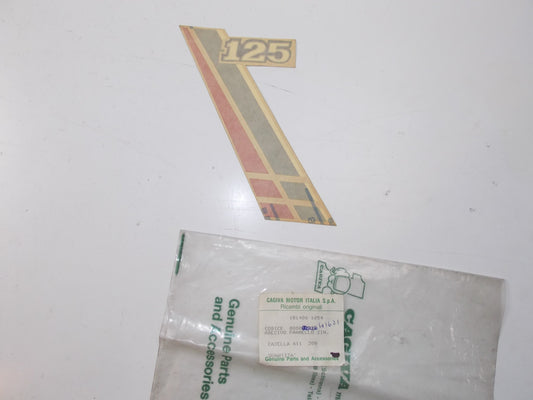 NOS OEM CAGIVA ALETTA ROSSA 125 TRIM LEFT GUARD STICKER "125" 800041621 - MotoRaider