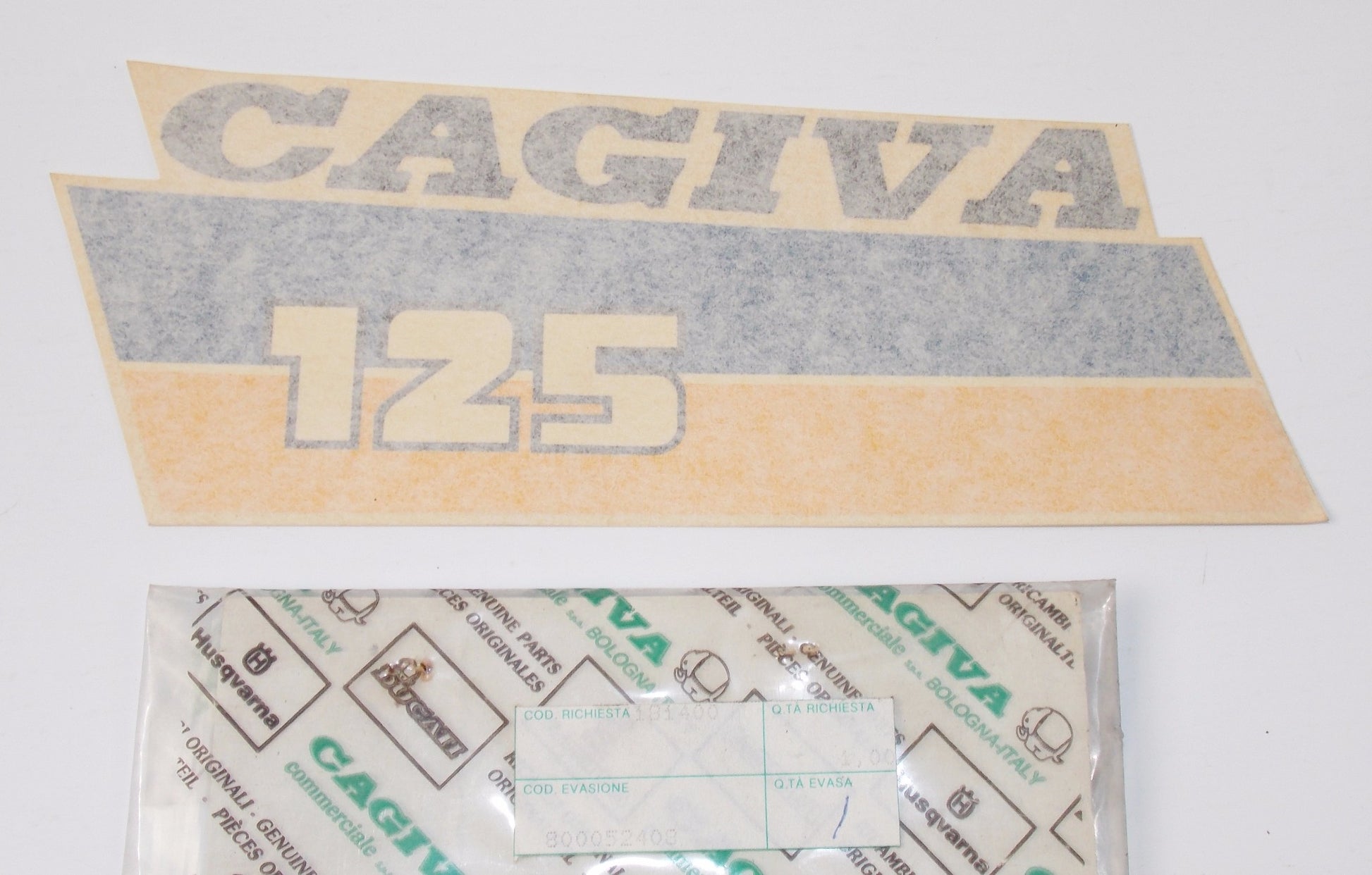 NOS OEM CAGIVA 1987 ELEFANTRE 125 RH GAS TANK STICKER "CAGIVA 125" 800052408 - MotoRaider