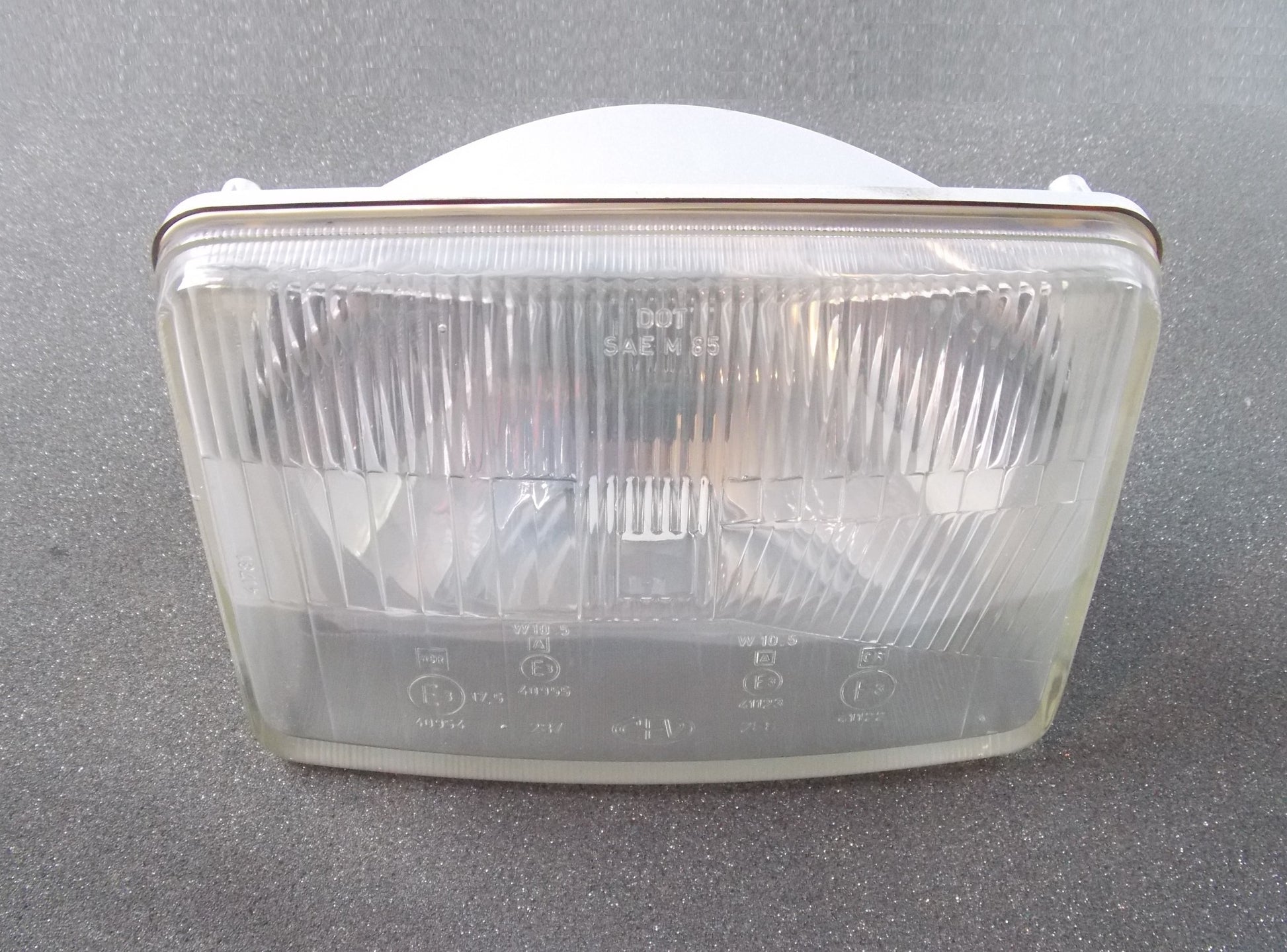 NOS CEV 287/288 HEADLIGHT 7.5" x 5" CAGIVA 1987 ELEFANT 650 OE 800046344 - MotoRaider