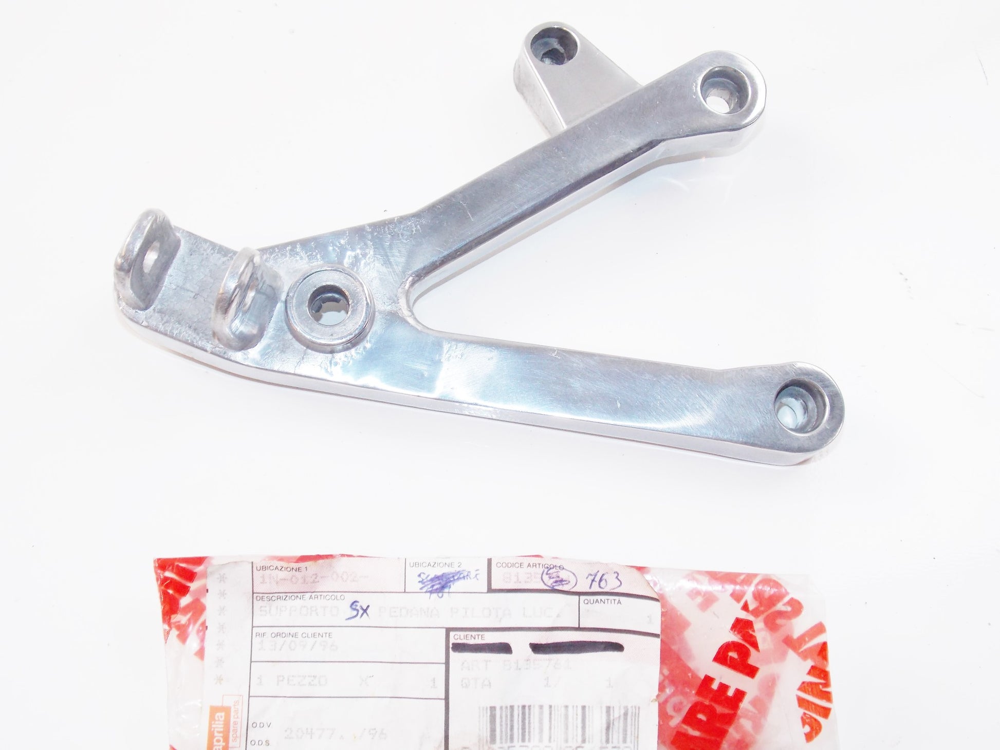 NOS OEM APRILIA 1995 RS 125 CHROME FRONT FOOT BRACKET AP8135763 - MotoRaider